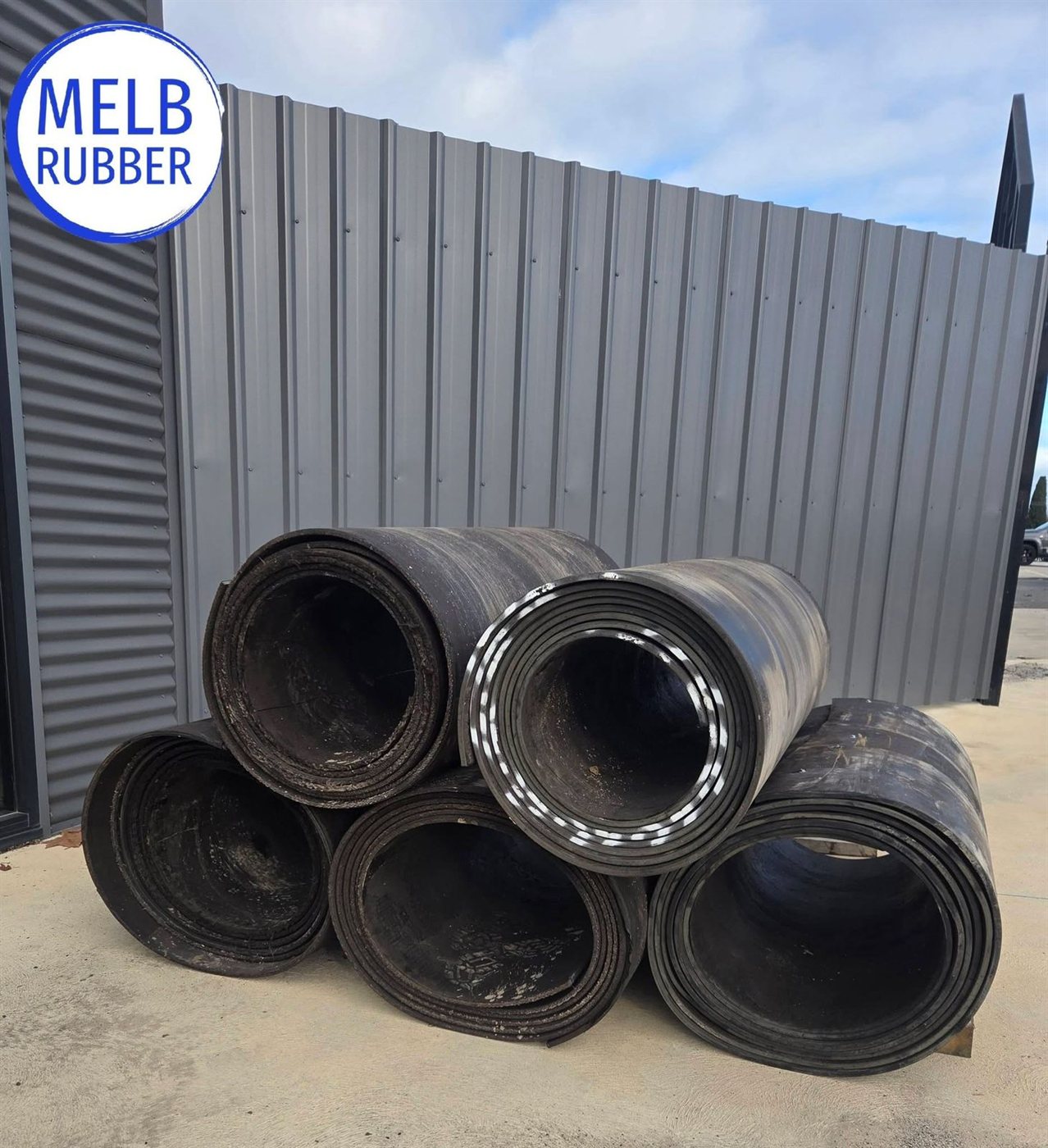 Stacked second-hand conveyor belt rolls